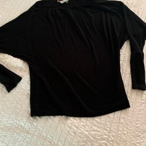 FP loose fitting, dolman sleeve black top. So versatile!